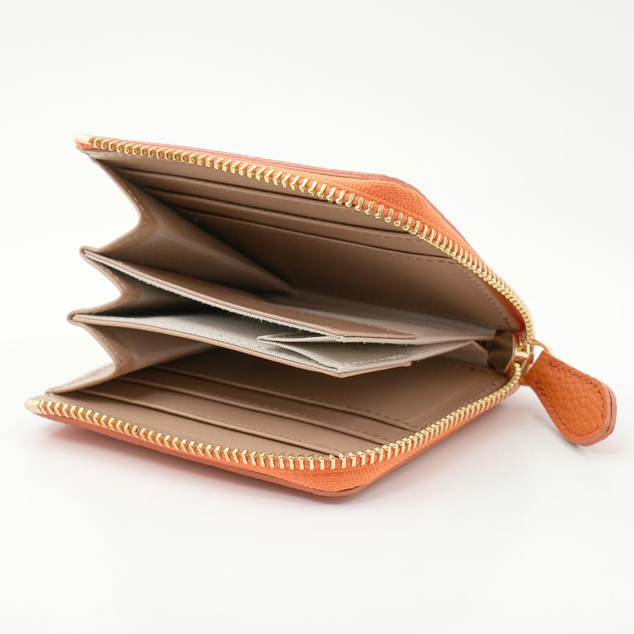 オレンジ色ののドイツシュリンクL字ファスナーミニ財布の使用例