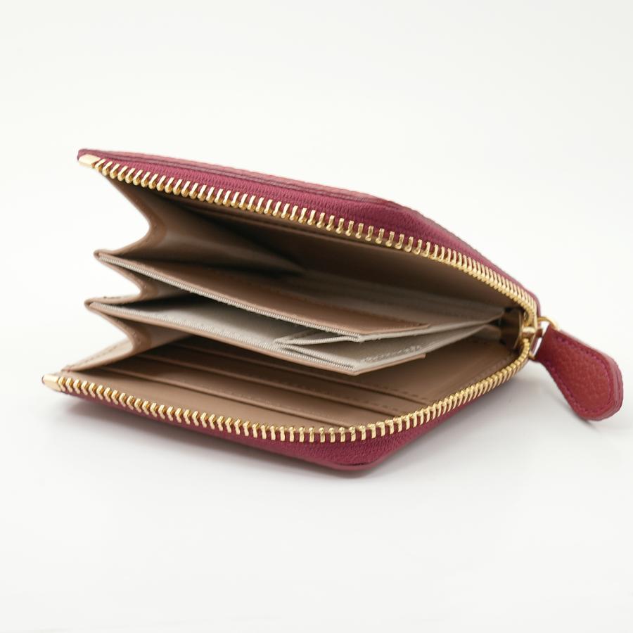 赤色のドイツシュリンクL字ファスナーミニ財布の使用例
